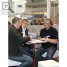 COPARTS Profi Service Tage 2011 Matthias Büscherhoff COPARTS (re.) und Marc Tegge (mi.) SPRINGER bei der gemeinsamen Werkstattplaung mit einem Kunden.  